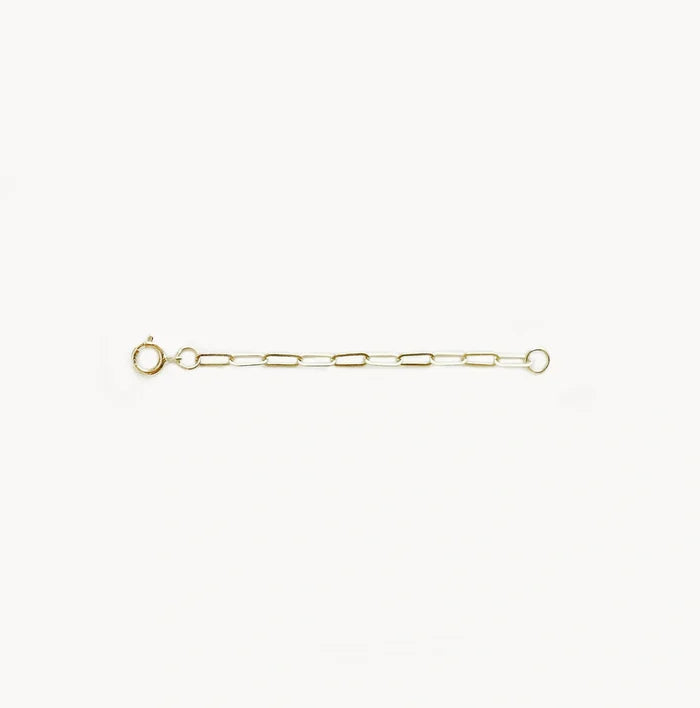 The 2" Infinite Inseparable Chain Extender in 14k yellow gold by bluboho is presented against a plain white background. This simple, delicate piece features elongated links and a round clasp, embodying a minimalist and elegant design perfect for everyday wear or layering with other jewelry.