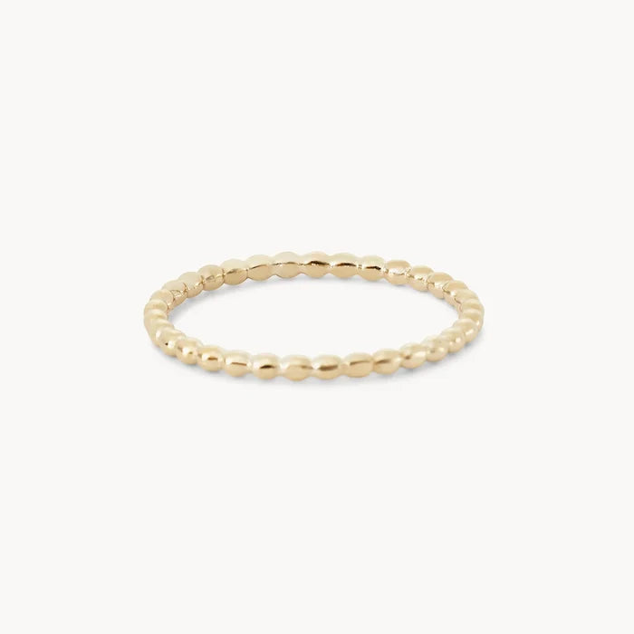 A thin, gold beaded ring with a simple and elegant design, evenly spaced small spherical beads forming the entire band. The abacus ring - 10k yellow gold by bluboho is displayed against a plain white background.