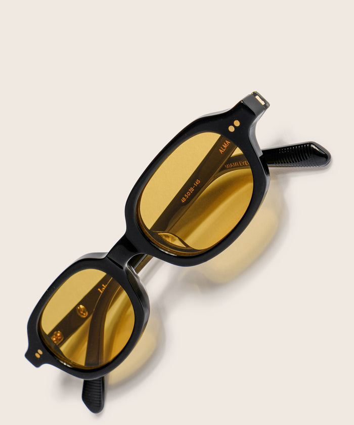 johann wolff alma black light sunglasses #color_black-burnt-yellow