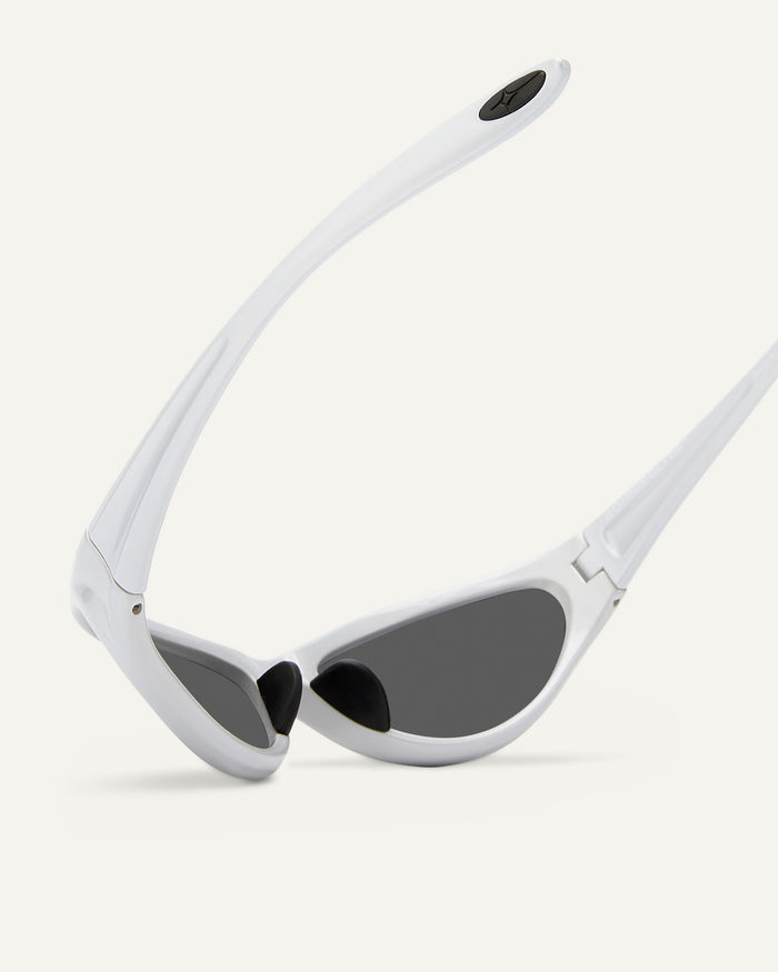Quarter shot of Bonnie Clyde Angel sunglasses in silver with black lenses.