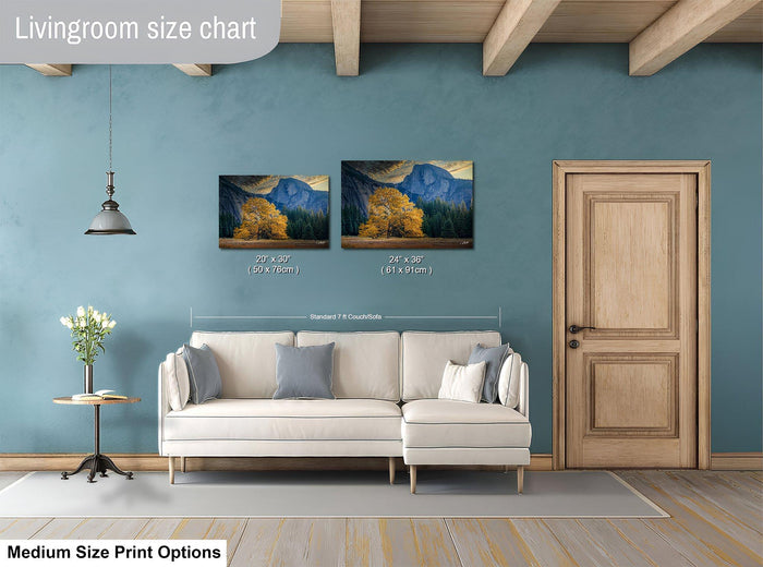 a living room with a white sofa, a wooden door, and a painting of a mountain landscape on the wall. The painting is of a size chart, indicating the dimensions of the artwork in relation to the sofa.