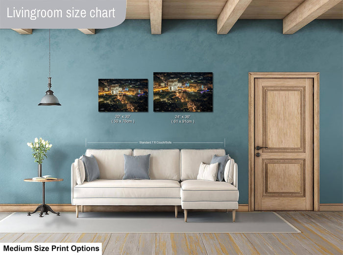 a living room with a white sofa, a wooden door, and a painting of a cityscape hanging on the wall.