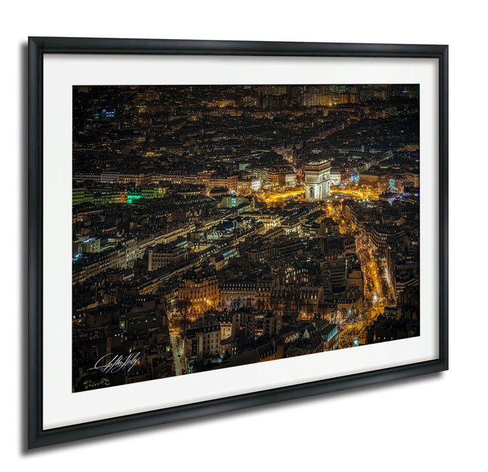 The image is a night view of a city, with numerous illuminated buildings and streets visible.