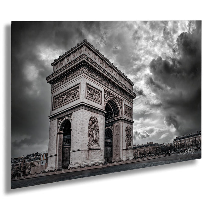 a large, ornate archway with intricate carvings and sculptures, set against a dramatic cloudy sky.