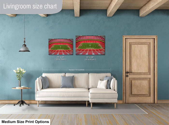 a living room with a white sofa, a wooden door, and a painting of a stadium on the wall. The painting is of a football stadium, and the sofa is white with gray pillows. The wall has a blue color, and there is a lamp hanging from the ceiling. The image is labeled as a livingroom size chart, and it includes a medium size print option.