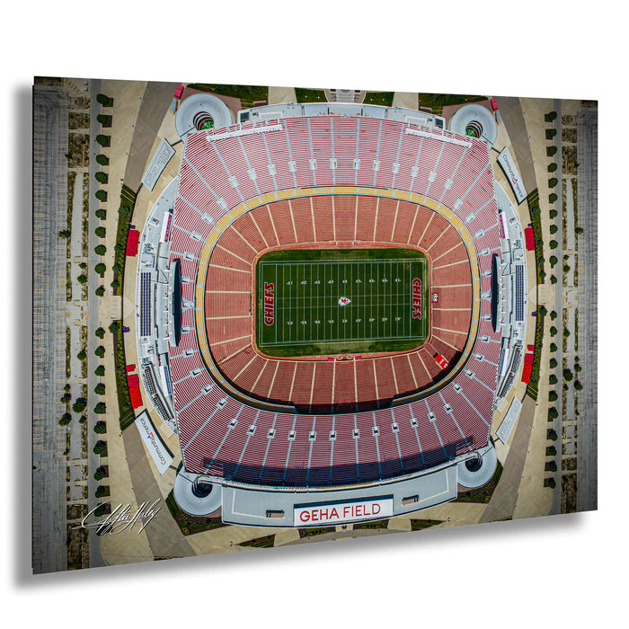 The image is an aerial view of a football stadium, specifically Kansas City Chiefs Stadium, with the football field prominently displayed in the center.