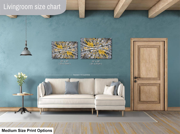 a living room with a white sofa, a wooden door, and a painting on the wall. The living room appears to be modern and well-decorated.