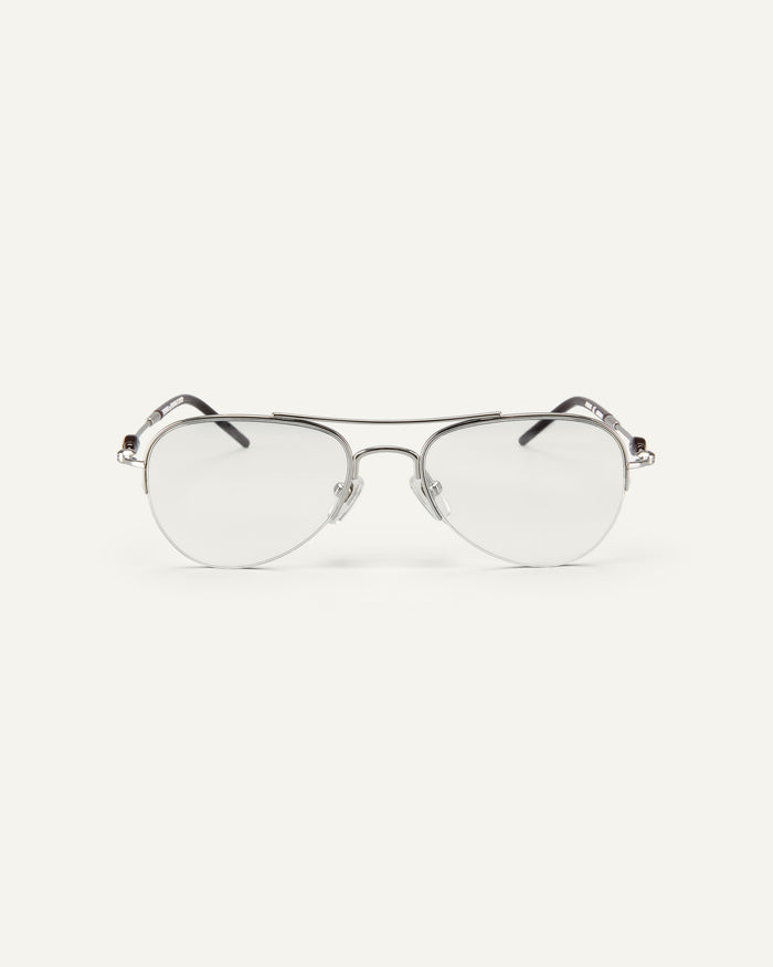 Face shot of Bonnie Clyde Autobio aviator optical frames in silver with clear lenses.