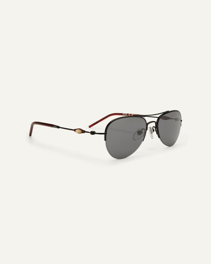 Quarter shot of Bonnie Clyde Autobio aviator sunglasses in black with black lenses.