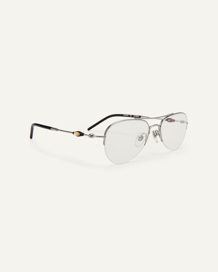 Side shot of Bonnie Clyde Autobio aviator optical frames in silver with clear lenses.