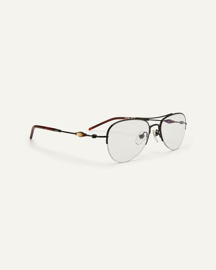 Side shot of Bonnie Clyde Autobio aviator optical frames in black with clear lenses.
