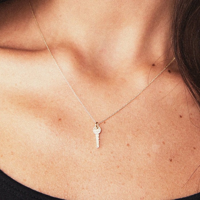 Avata Key Charm in 10k yellow gold, alternate angle detail view