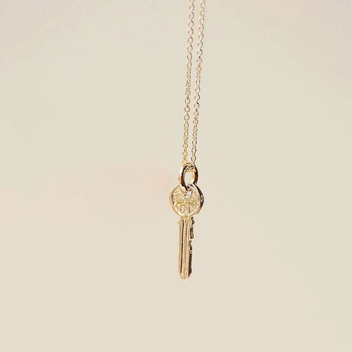 Avata Key Charm in 10k yellow gold, studio detail view