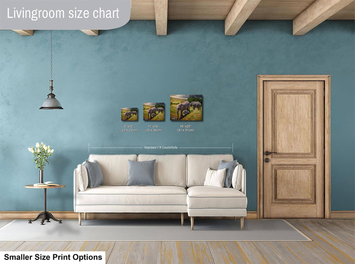 a living room with a white sofa, a wooden door, and a hanging light fixture. There are three framed prints of elephants displayed on the wall, each with different sizes. The text "Livingroom size chart" is visible, indicating that the image is a size chart for the living room.