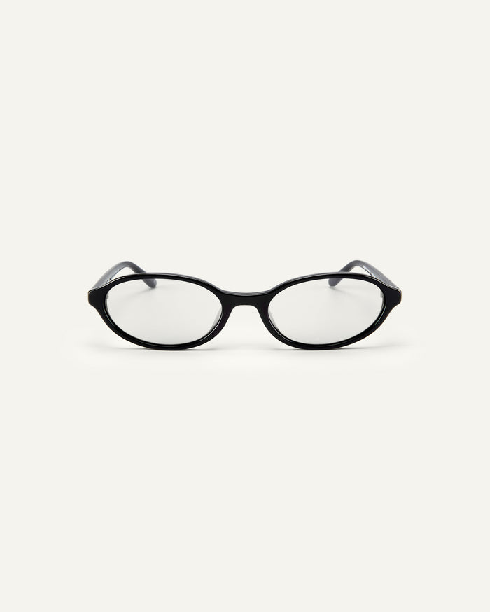 Face shot of Bonnie Clyde Baby oval optical frames in black with clear lenses.