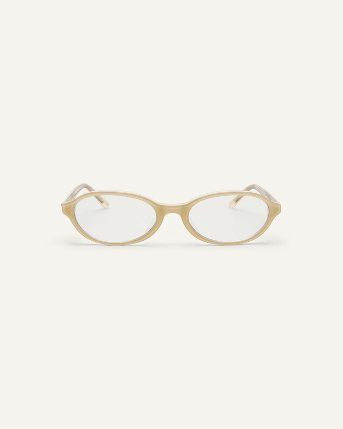 Face shot of Bonnie Clyde Baby oval optical frames in layered off white with clear lenses.