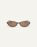 Face shot of Bonnie Clyde Baby oval sunglasses in layered silver with brown lenses.