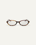 Face shot of Bonnie Clyde Baby oval optical frames in tortoise with clear lenses.