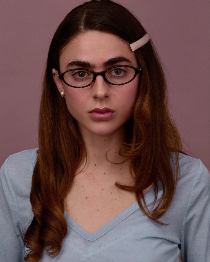 Quarter shot of Bonnie Clyde Baby oval optical frames in tortoise with clear lenses.
