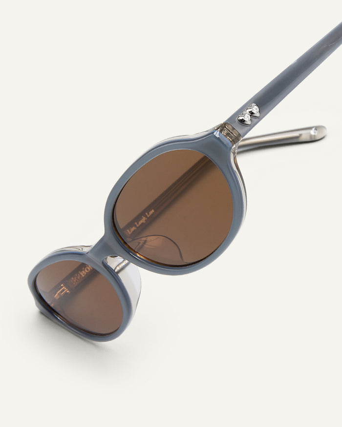 Additional detail of Bonnie Clyde Baby oval sunglasses in layered silver with brown lenses.