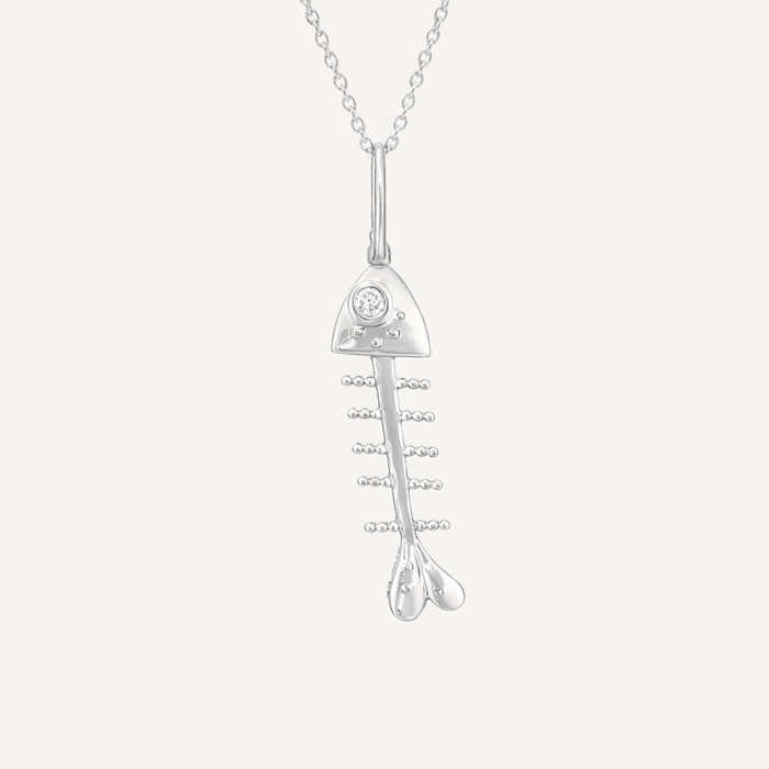 bare bones fish necklace charm sterling silver on white background.