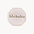 A blush-colored velvet octagonal box, branded with "beloved by bluboho" in gold font on the lid, set against a plain white background.