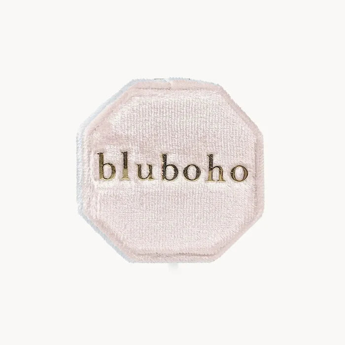 A blush-colored velvet octagonal box, branded with "beloved by bluboho" in gold font on the lid, set against a plain white background.
