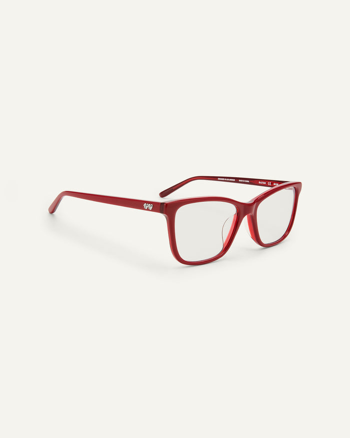 Quarter shot of Bonnie Clyde Bicep optical frames in layered red with clear lenses.