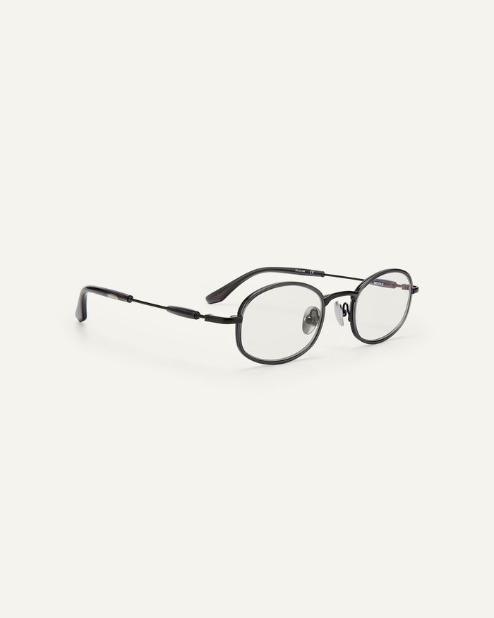 Quarter shot of Bonnie Clyde Bicycle optical frames in grey with clear lenses.