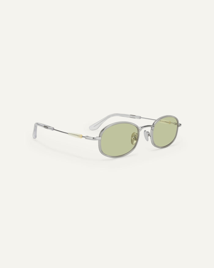 Quarter shot of Bonnie Clyde Bicycle sunglasses in silver with green lenses.