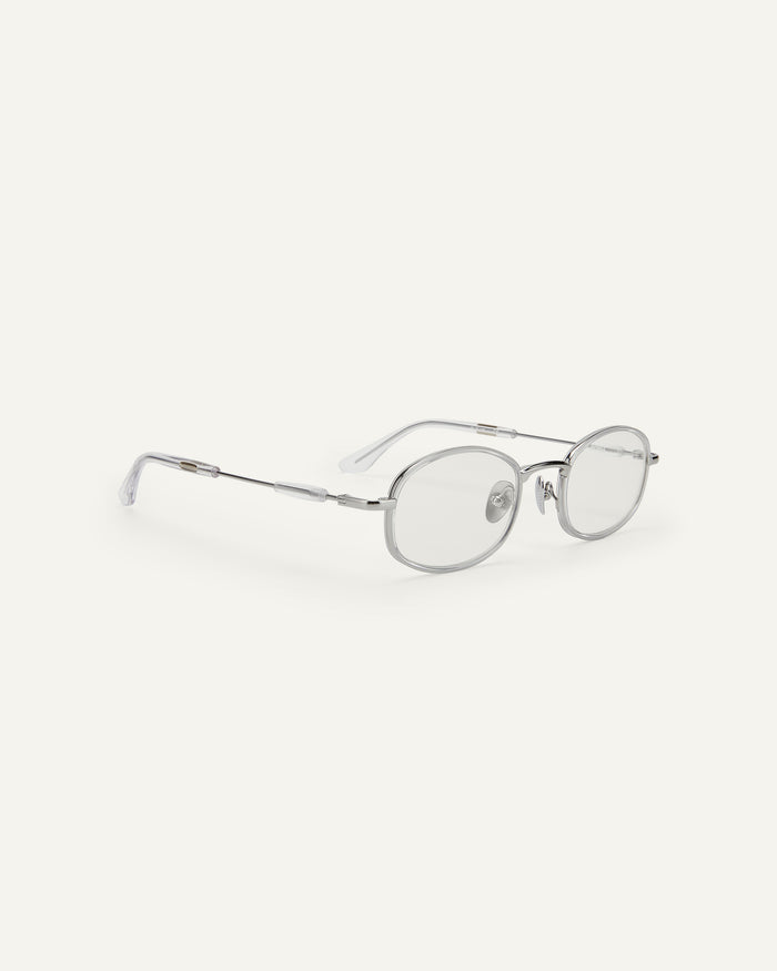 Quarter shot of Bonnie Clyde Bicycle optical frames in silver with clear lenses.