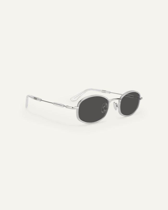 Quarter shot of Bonnie Clyde Bicycle sunglasses in silver with black lenses.