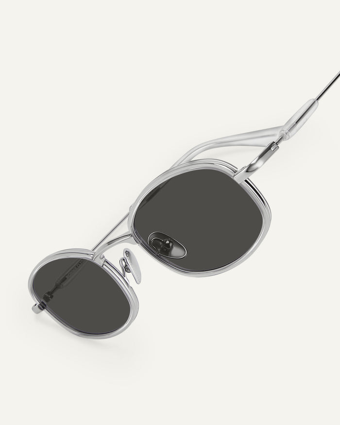 Side shot of Bonnie Clyde Bicycle sunglasses in silver with black lenses.