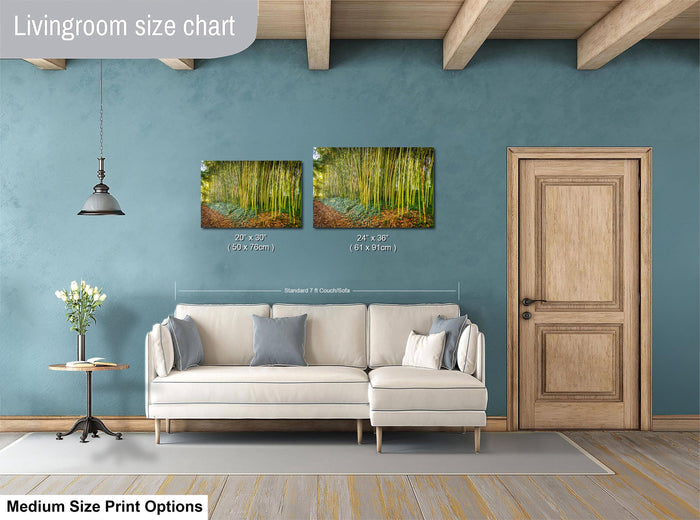 a living room with a white sofa, a wooden door, and a painting of a forest scene on the wall.
