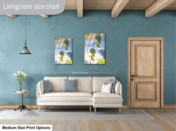 a living room with a white sofa, a wooden door, and a painting of a bird hanging from a wire. The living room has a blue wall and a wooden ceiling.