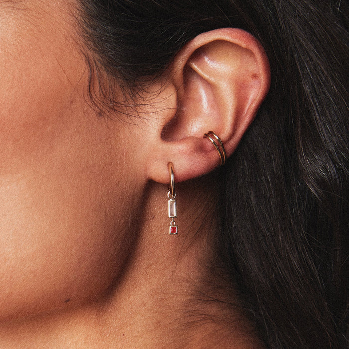 Blessings Abound Moonstone Earring Charm in 10k yellow gold with moonstone and ruby gemstones, alternate angle detail view