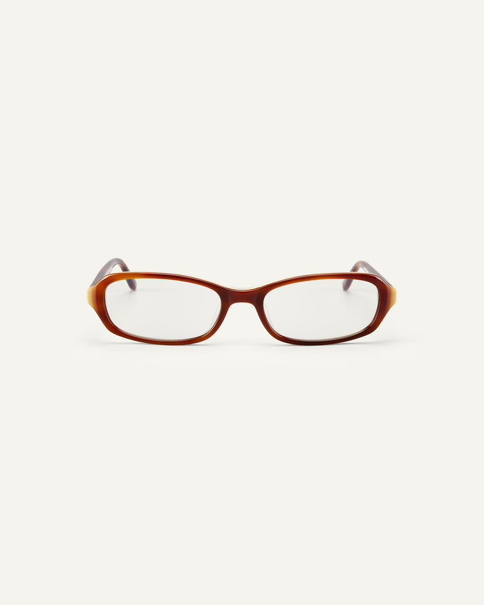 Face shot of Bonnie Clyde Blondie optical frames in layered brown with clear lenses.