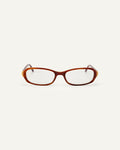 Face shot of Bonnie Clyde Blondie optical frames in layered brown with clear lenses.