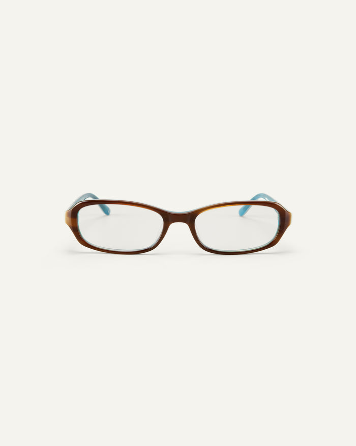 Face shot of Bonnie Clyde Blondie optical frames in layered teal demi with clear lenses.