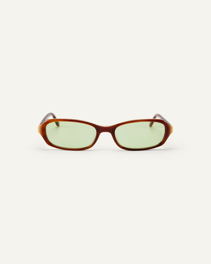Face shot of Bonnie Clyde Blondie sunglasses in brown with green lenses.