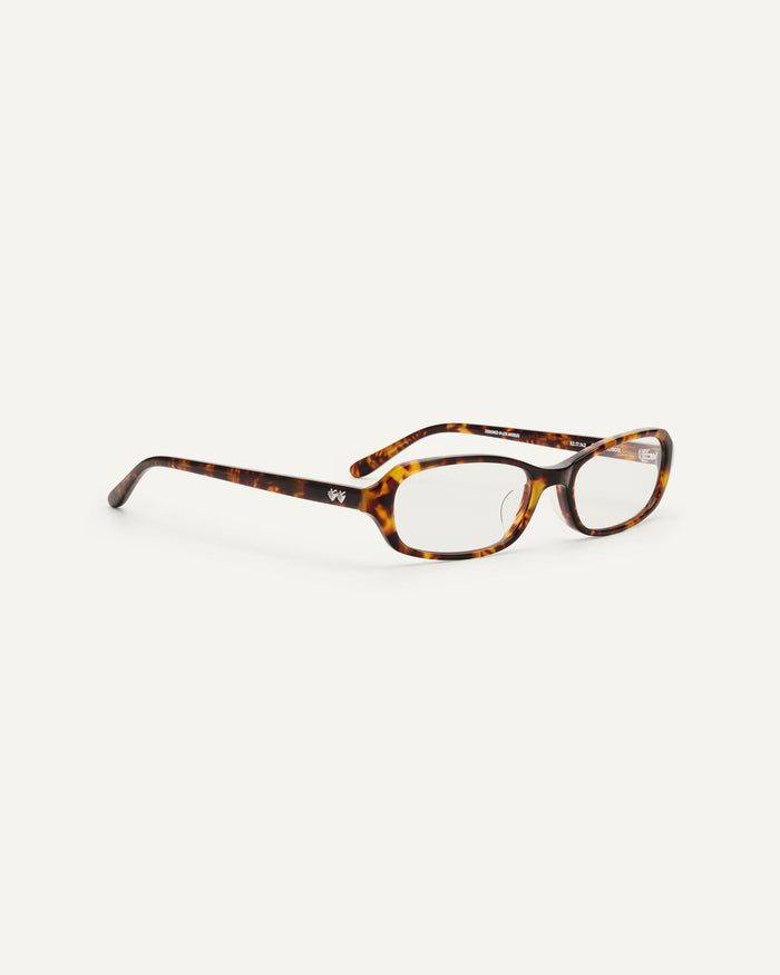 Side shot of Bonnie Clyde Blondie optical frames in tortoise with clear lenses.