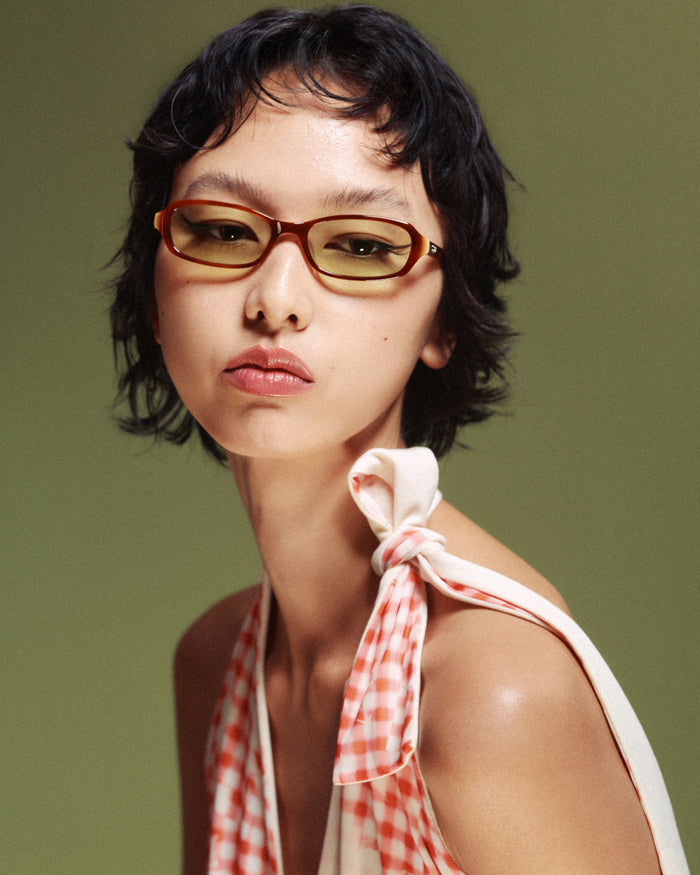 Side shot of Bonnie Clyde Blondie sunglasses in brown with green lenses.
