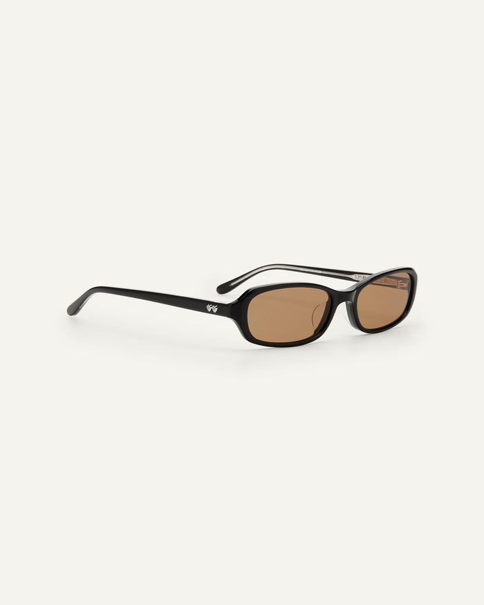Side shot of Bonnie Clyde Blondie sunglasses in black with brown lenses.
