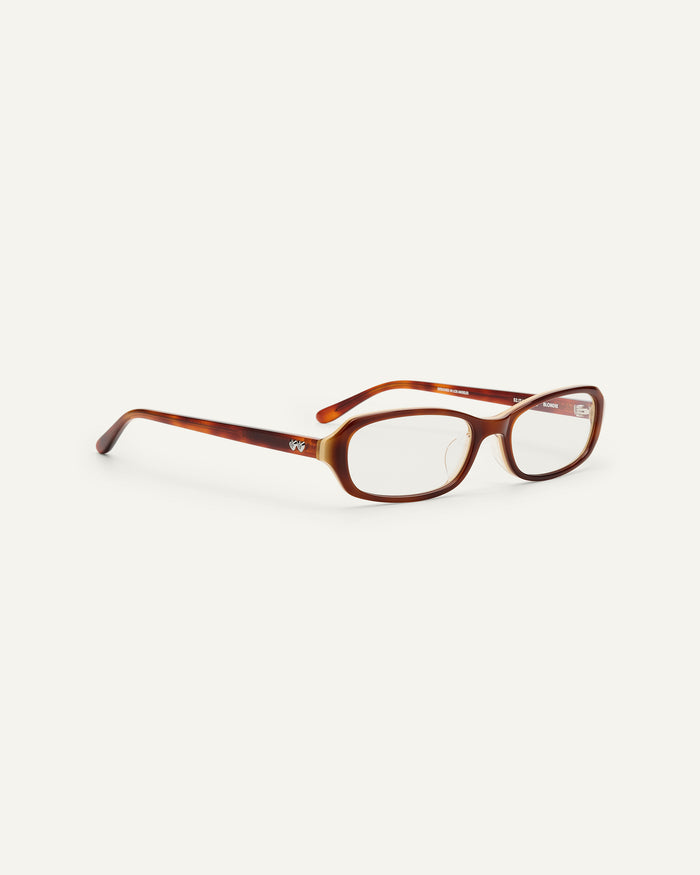 Side shot of Bonnie Clyde Blondie optical frames in layered brown with clear lenses.