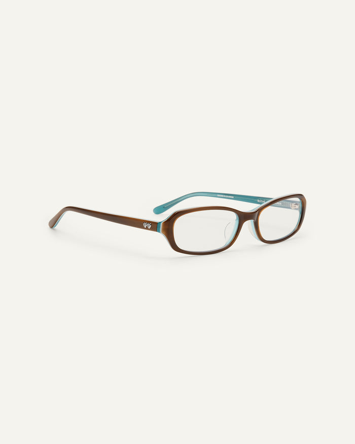 Close-up shot of Bonnie Clyde Blondie optical frames in layered teal demi with clear lenses.