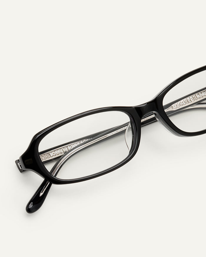 Detail shot of Bonnie Clyde Blondie optical frames in black with clear lenses.