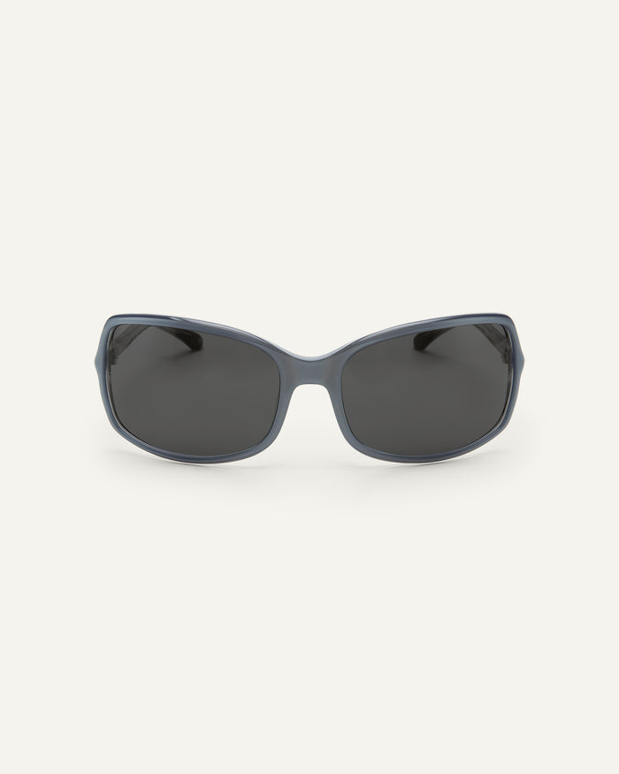 Face shot of Bonnie Clyde Body rounded square sunglasses in layered silver with black lenses.