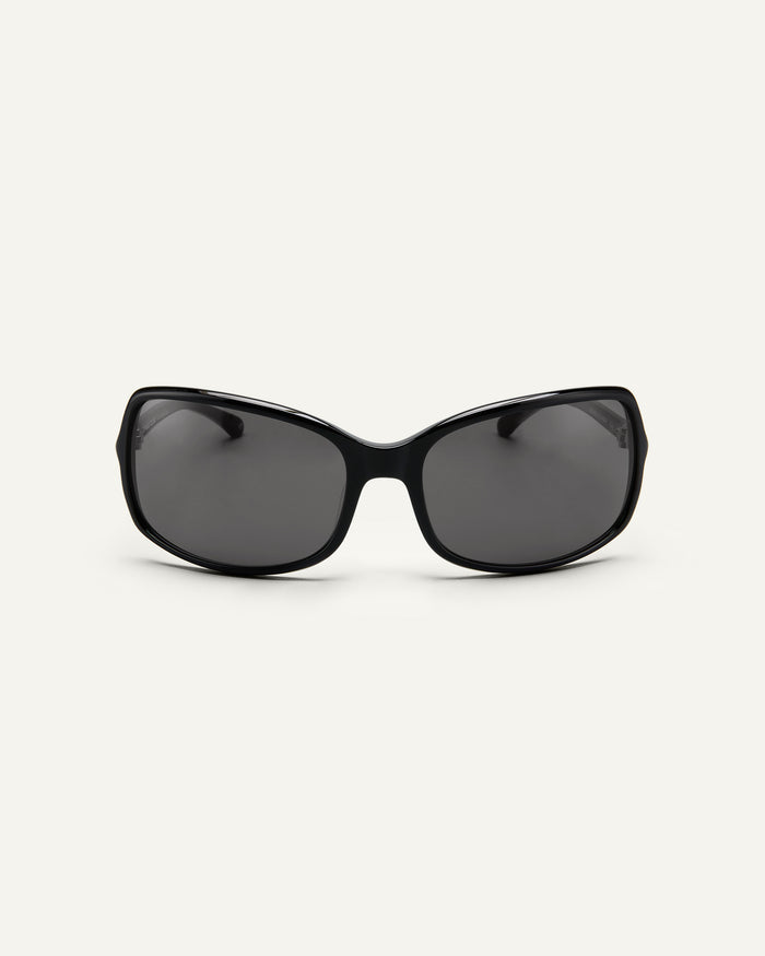 Face shot of Bonnie Clyde Body rounded square sunglasses in black with black lenses.