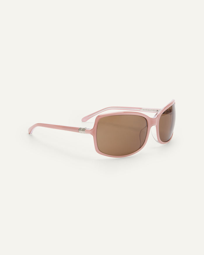 Side shot of Bonnie Clyde Body rounded square sunglasses in layered pink with brown lenses.