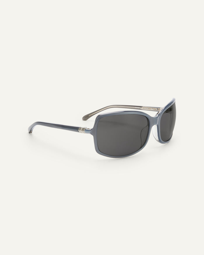 Side shot of Bonnie Clyde Body rounded square sunglasses in layered silver with black lenses.